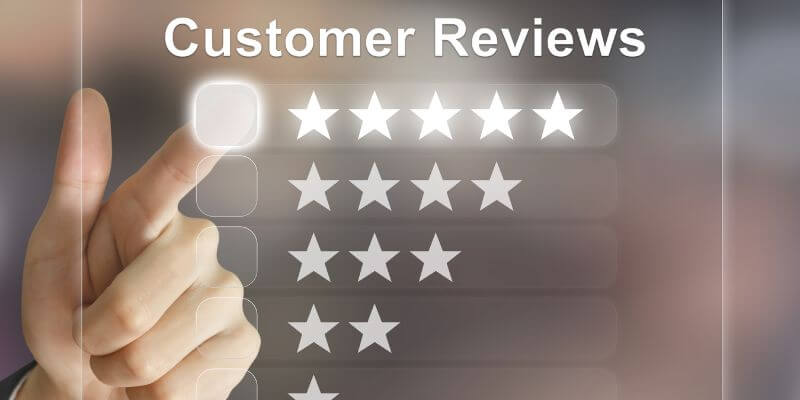 A person giving a business a five-star review showing the benefits of repurposing content